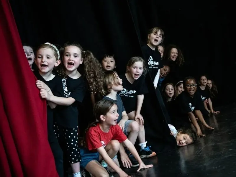 Cherry Stars students behind the curtain